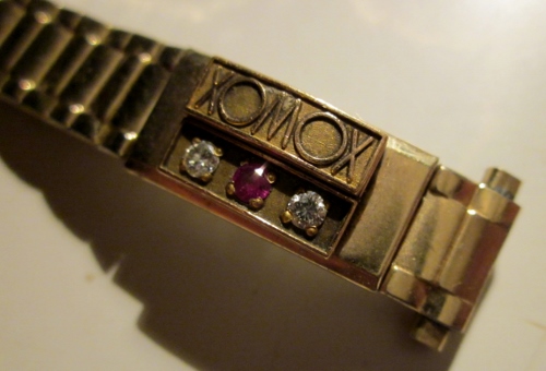 watch band with stones/logo
