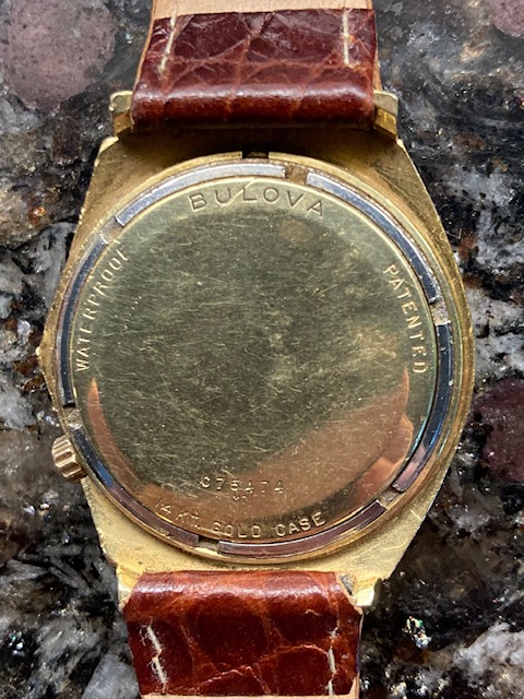 caseback shows Bulova at top, C75474   M7 at bottom,  waterproof on left side as viewing back of case,  patented on right side as viewing back of case