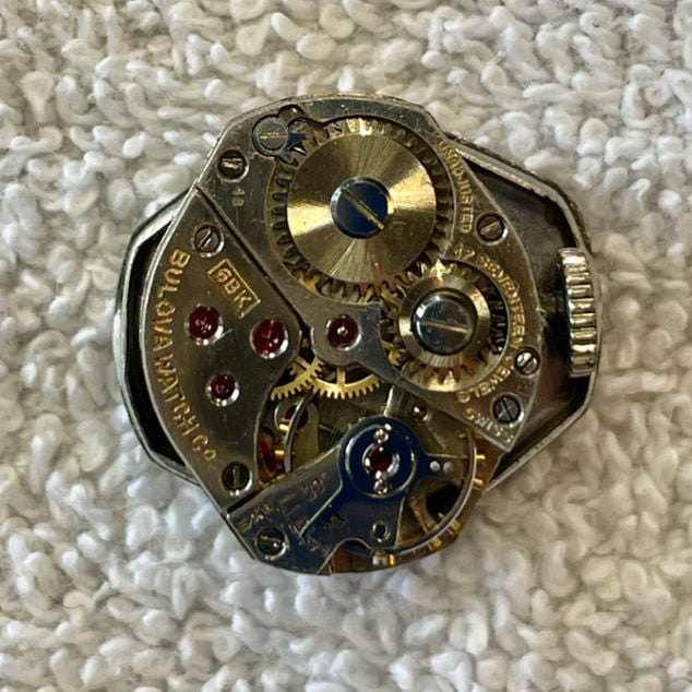 Inside of Watch movement with visible markings for style and year produced