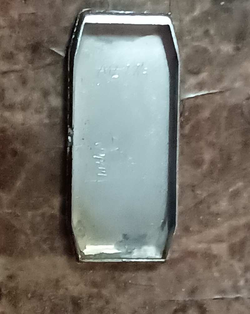 Inside of watch case, i can not make out inscriptions. One I believe is an ACT number