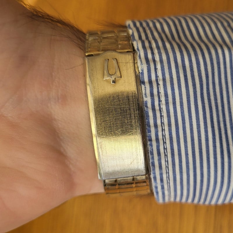 Bulova clasp on bottom of gold scale bracelet
